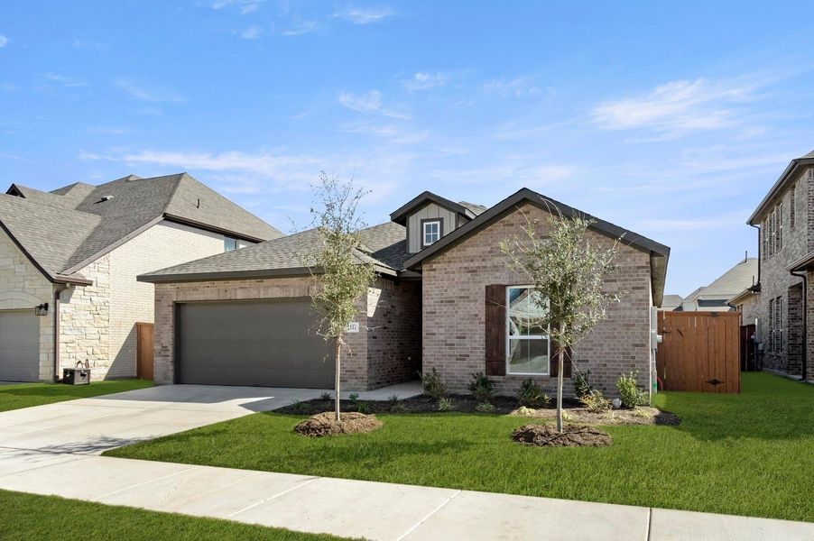 Front exterior of a new home in Oaks at San Gabriel, Georgetown, TX, highlighting curb appeal (Image 2). Front exterior of a new home in Oaks at San Gabriel, Georgetown, TX, highlighting curb appeal (Image 2).