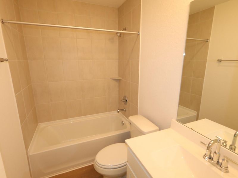 Furnished interior view inside a new home in Sorella, Tomball (Image 8).