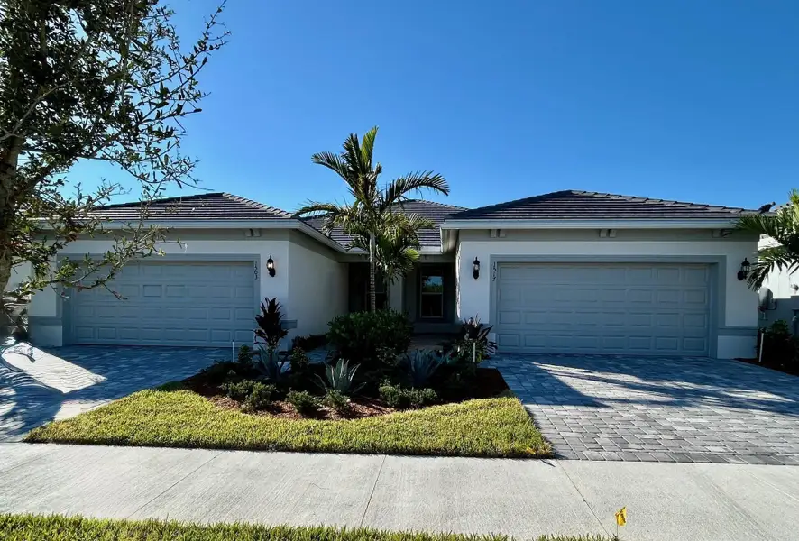 Front exterior of a new home in Costa Pointe, Vero Beach, FL, highlighting curb appeal (Image 1). Front exterior of a new home in Costa Pointe, Vero Beach, FL, highlighting curb appeal (Image 1).