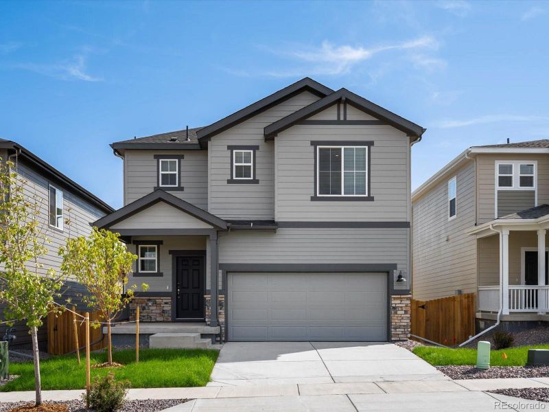 Front exterior of a new home in Lake Bluff, Greeley, CO, highlighting curb appeal (Image 20). Front exterior of a new home in Lake Bluff, Greeley, CO, highlighting curb appeal (Image 20).