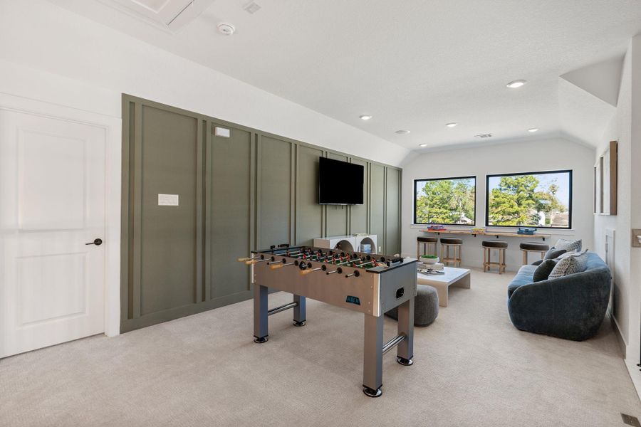 Upstairs game room offers a versatile retreat ideal for recreation, media, or casual living.