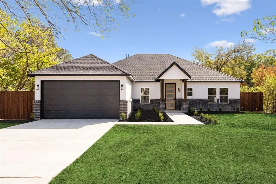 Front exterior of a new home in , Mesquite, TX, highlighting curb appeal (Image 1).