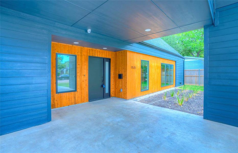 Modern exterior featuring horizontal wood-finish siding complemented by blue horizontal siding