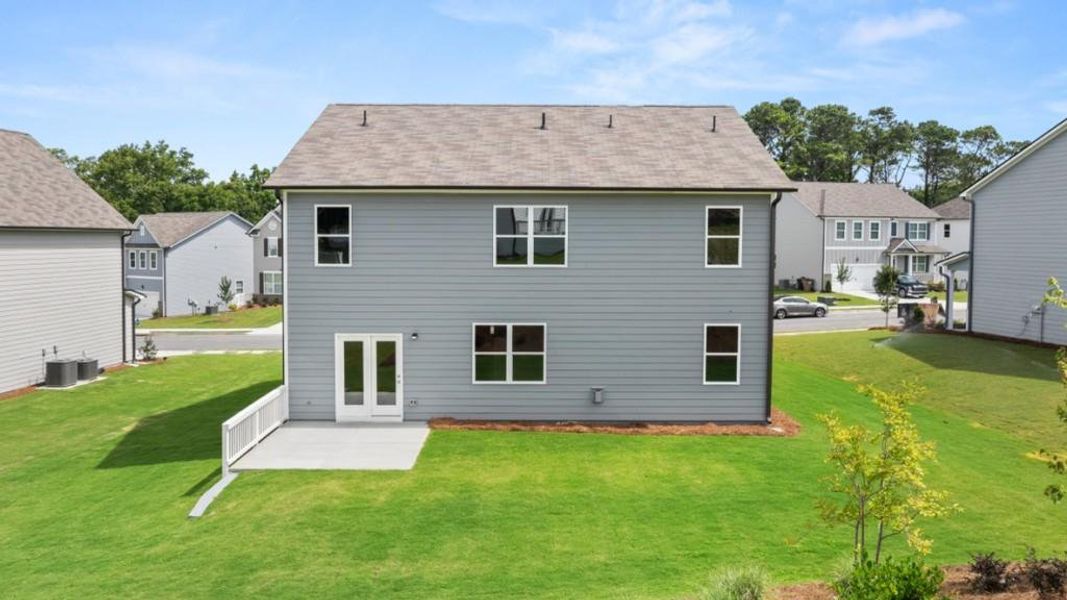 Exterior details and patio area of a home in Liberty Crossing, Braselton (Image 4).