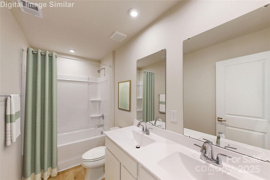 This guest bath blends fun and function! The tub is perfect for splashy playtime or a relaxing soak, while dual vanities and mirrors make busy mornings a breeze. With plenty of cabinet storage, it’s stylish, spacious, and ready to handle daily life with ease. This guest bath blends fun and function! The tub is perfect for splashy playtime or a relaxing soak, while dual vanities and mirrors make busy mornings a breeze. With plenty of cabinet storage, it’s stylish, spacious, and ready to handle daily life with ease.
