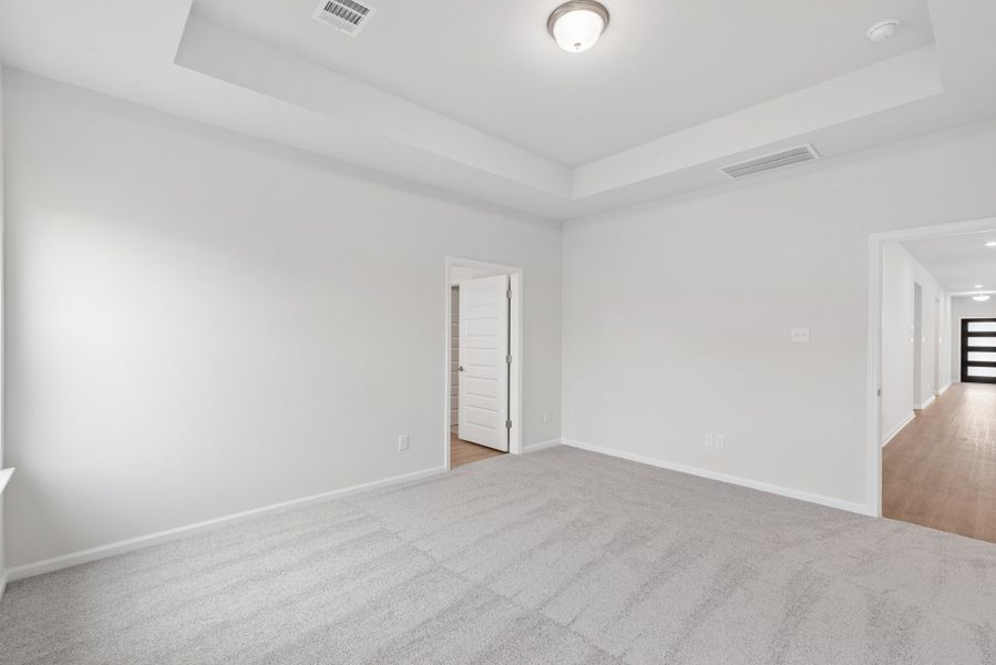 The Oakshire II- Primary Bedroom with Tray Ceiling.  Sample image for illustration; upgrades, options, and colors may vary.