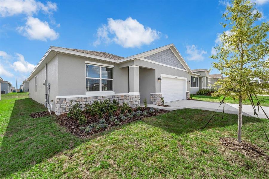 Front exterior of a new home in Scenic Terrace, Lake Hamilton, FL, highlighting curb appeal (Image 2). Front exterior of a new home in Scenic Terrace, Lake Hamilton, FL, highlighting curb appeal (Image 2).