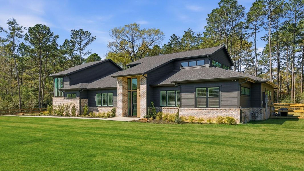 Front exterior of a new home in , Magnolia, TX, highlighting curb appeal (Image 21).