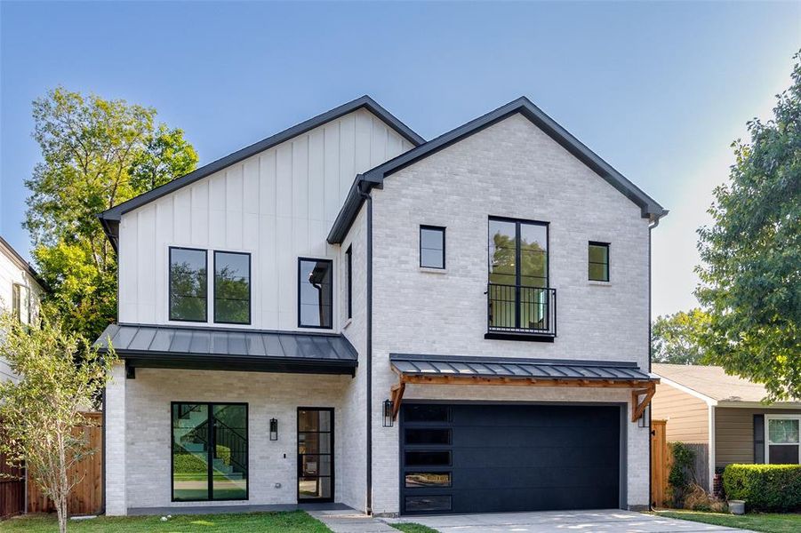 Modern farmhouse style home featuring a garage