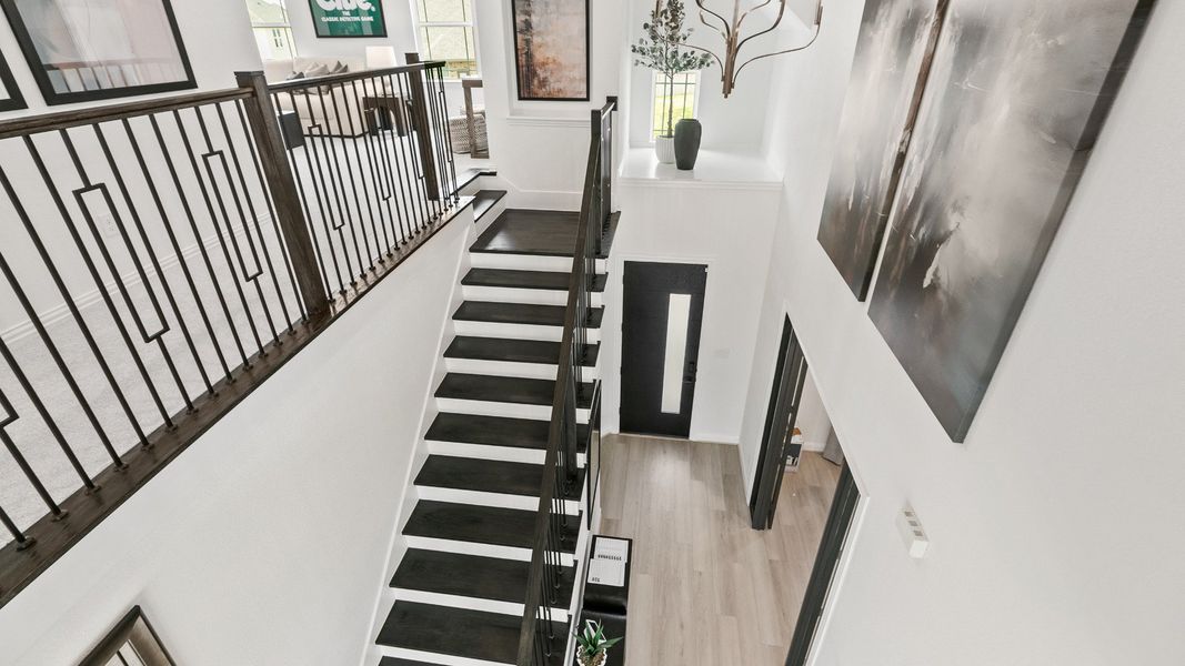 Representative furnished interior of a home built from the Mimosa by Brightland Homes in Sunterra, Katy (Image 7).