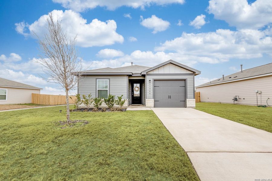 Front exterior of a new home in Luckey Ranch, San Antonio, TX, highlighting curb appeal (Image 1). Front exterior of a new home in Luckey Ranch, San Antonio, TX, highlighting curb appeal (Image 1).