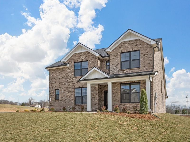 Front exterior of a new home in Benders Cove, Mount Juliet, TN, highlighting curb appeal (Image 2). Front exterior of a new home in Benders Cove, Mount Juliet, TN, highlighting curb appeal (Image 2).