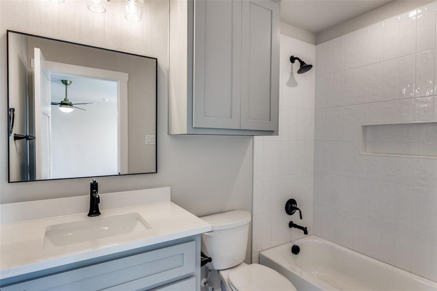 Bathroom featuring shower / bath combination and vanity Bathroom featuring shower / bath combination and vanity