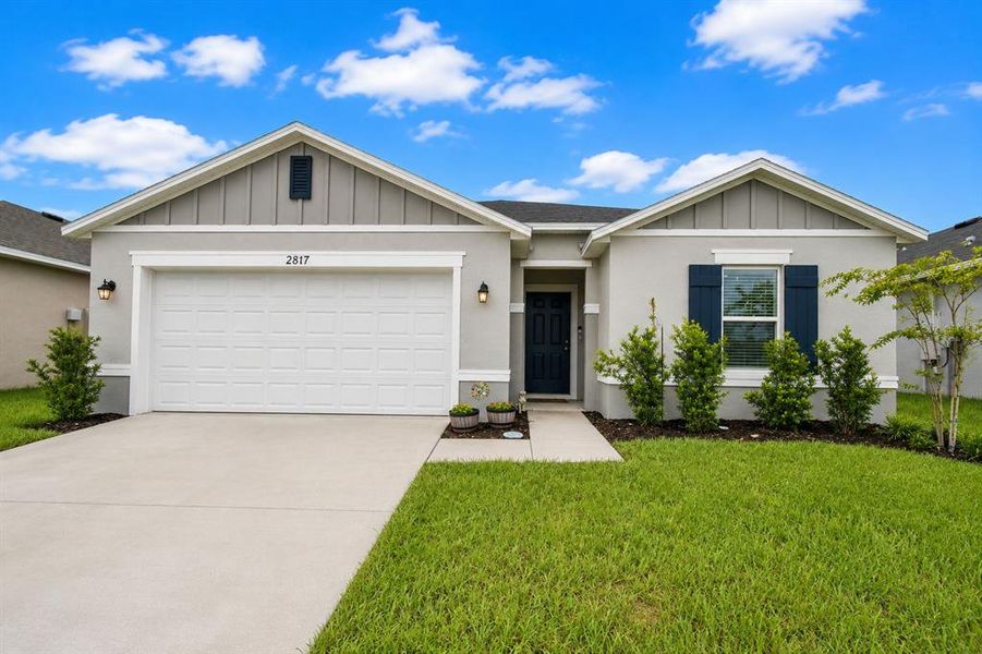 Front exterior of a new home in , Haines City, FL, highlighting curb appeal (Image 24). Front exterior of a new home in , Haines City, FL, highlighting curb appeal (Image 24).