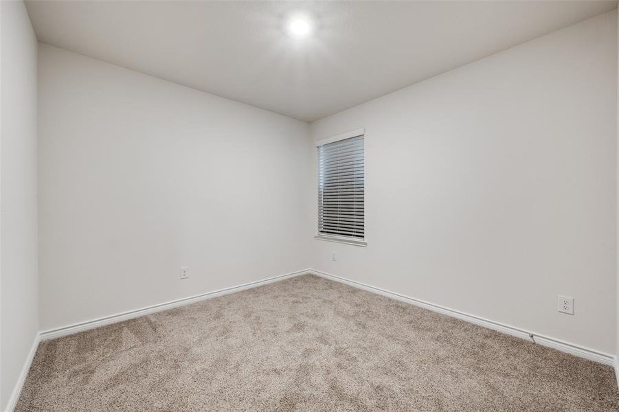 Spare room with carpet floors and baseboards