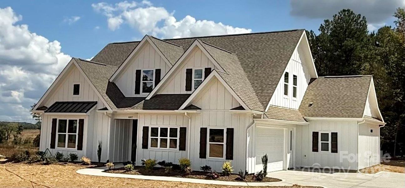 Front exterior of a new home in , Waxhaw, NC, highlighting curb appeal (Image 17). Front exterior of a new home in , Waxhaw, NC, highlighting curb appeal (Image 17).