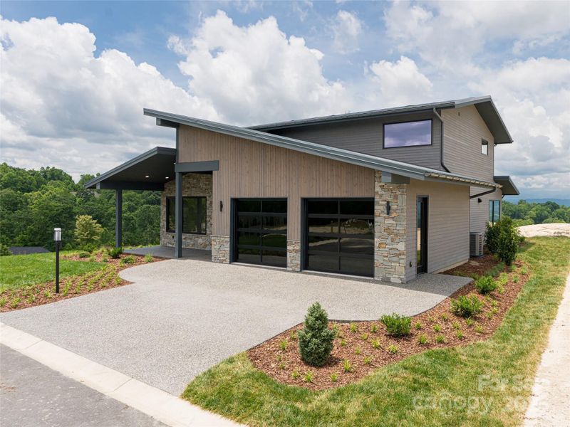 Front exterior of a new home in , Hendersonville, NC, highlighting curb appeal (Image 1).