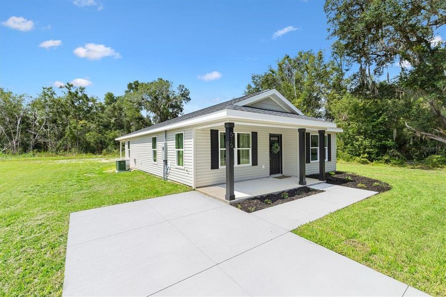 Front exterior of a new home in , Bushnell, FL, highlighting curb appeal (Image 23).