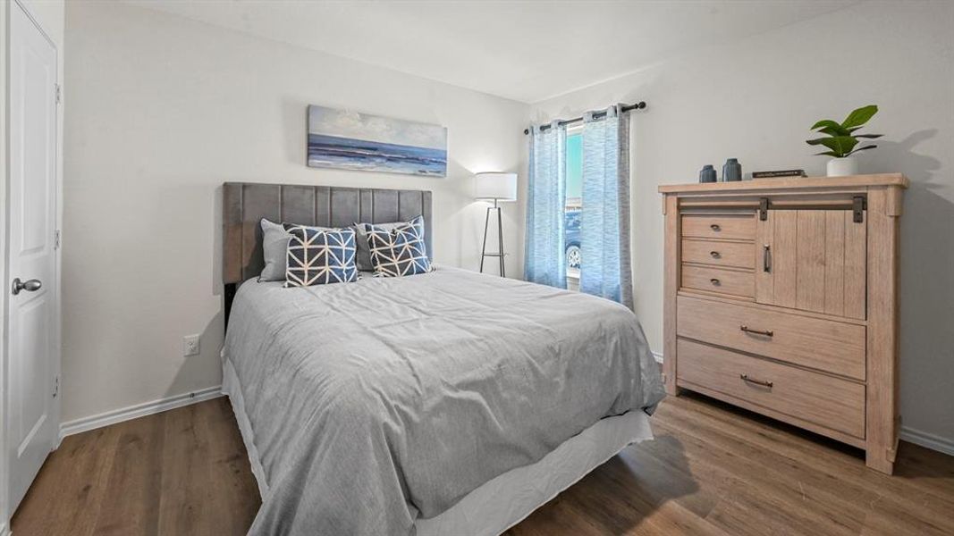 Bedroom with wood finished floors