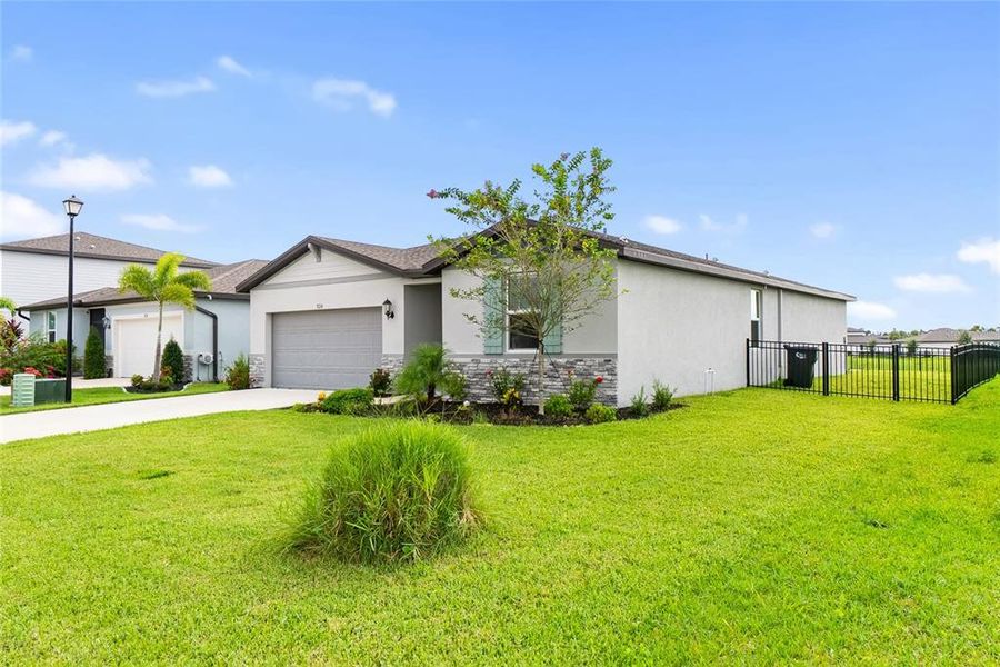 Front exterior of a new home in Salt Meadows - Classic Series, Parrish, FL, highlighting curb appeal (Image 28).