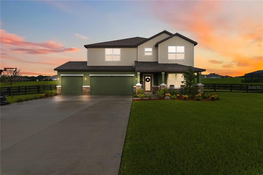 Front exterior of a new home in , Thonotosassa, FL, highlighting curb appeal (Image 1). Front exterior of a new home in , Thonotosassa, FL, highlighting curb appeal (Image 1).