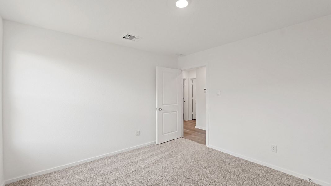 Representative unfurnished interior of a home built from the Estero by D.R. Horton in Lake Conroe Cove, Willis (Image 22). Representative unfurnished interior of a home built from the Estero by D.R. Horton in Lake Conroe Cove, Willis (Image 22).