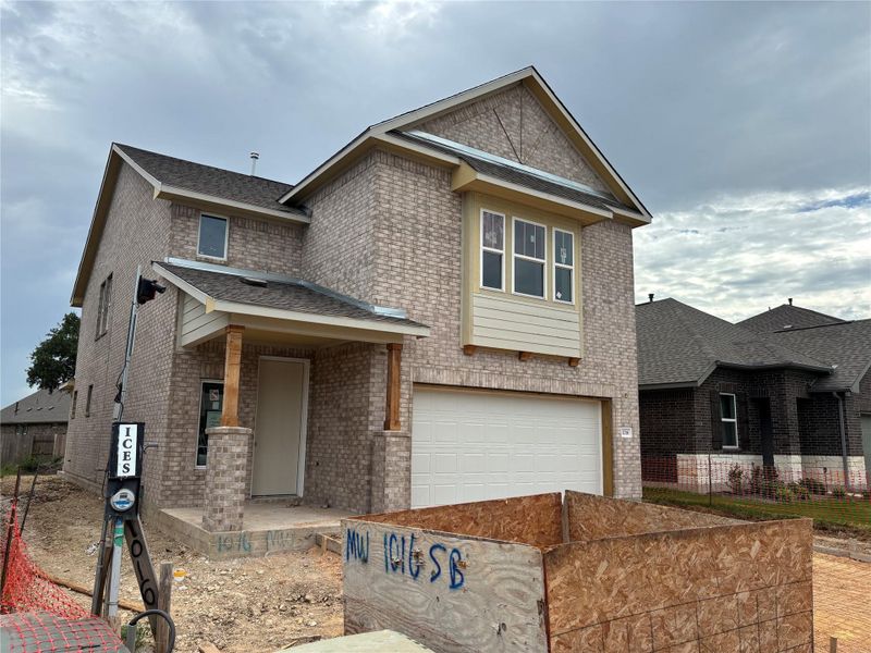 Front exterior of a new home in Berry Creek Highlands, Georgetown, TX, highlighting curb appeal (Image 21). Front exterior of a new home in Berry Creek Highlands, Georgetown, TX, highlighting curb appeal (Image 21).