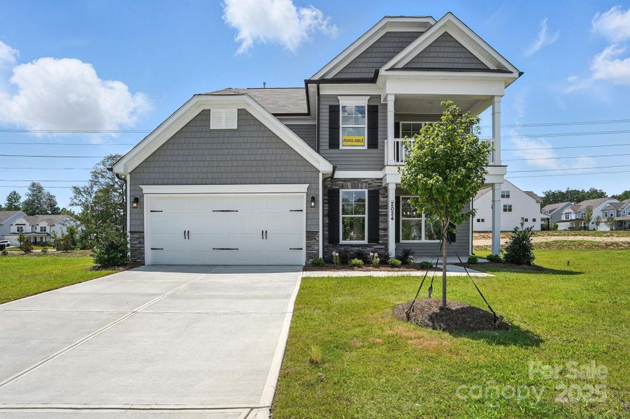 Front exterior of a new home in Hampton Woods, Charlotte, NC, highlighting curb appeal (Image 22).