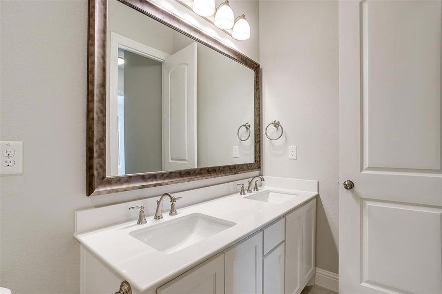 Bathroom featuring double sink vanity