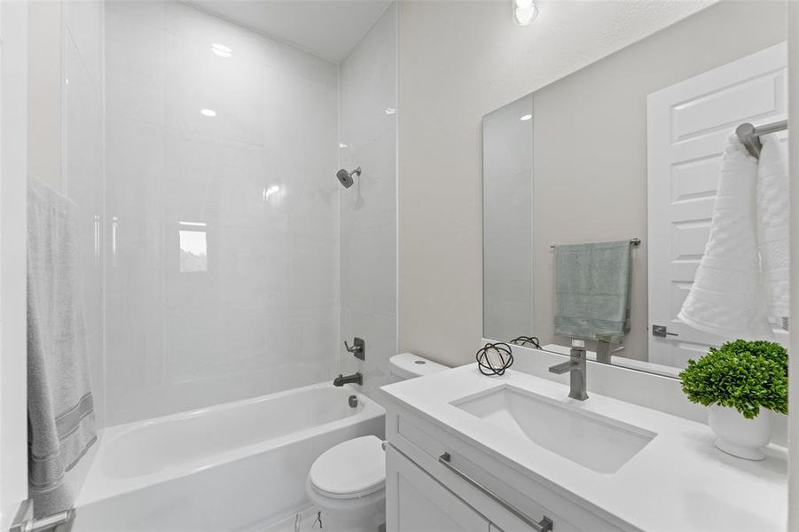 Bathroom featuring shower / washtub combination and vanity Bathroom featuring shower / washtub combination and vanity