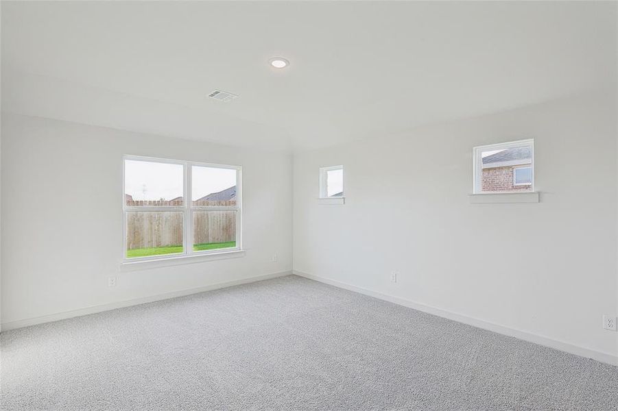 Spare room featuring carpet