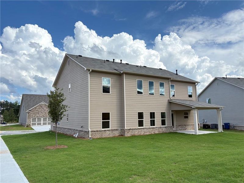 Front exterior of a new home in , Loganville, GA, highlighting curb appeal (Image 20).