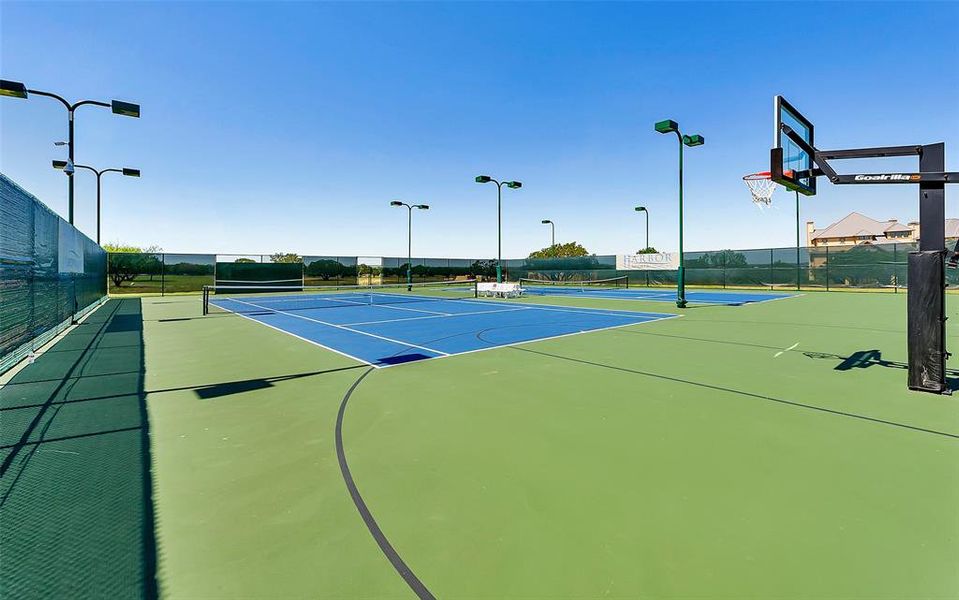 View of tennis court featuring community basketball court View of tennis court featuring community basketball court