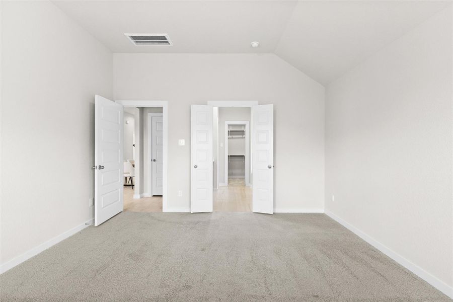 This primary suite offers a smart, functional layout with direct access to a spacious walk in closet and private en suite bath, both just steps from the bed. Vaulted ceilings add an airy, open feel, while soft neutral carpet and fresh paint create a clean, move in ready backdrop. It's a thoughtfully designed retreat where everyday convenience meets comfortable living. This primary suite offers a smart, functional layout with direct access to a spacious walk in closet and private en suite bath, both just steps from the bed. Vaulted ceilings add an airy, open feel, while soft neutral carpet and fresh paint create a clean, move in ready backdrop. It's a thoughtfully designed retreat where everyday convenience meets comfortable living.