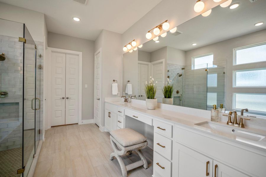 Mornings feel a little more glamorous at this long dual-sink vanity with excellent storage, a full-width mirror, stylish lighting and knee space where you can sit comfortably while getting ready.