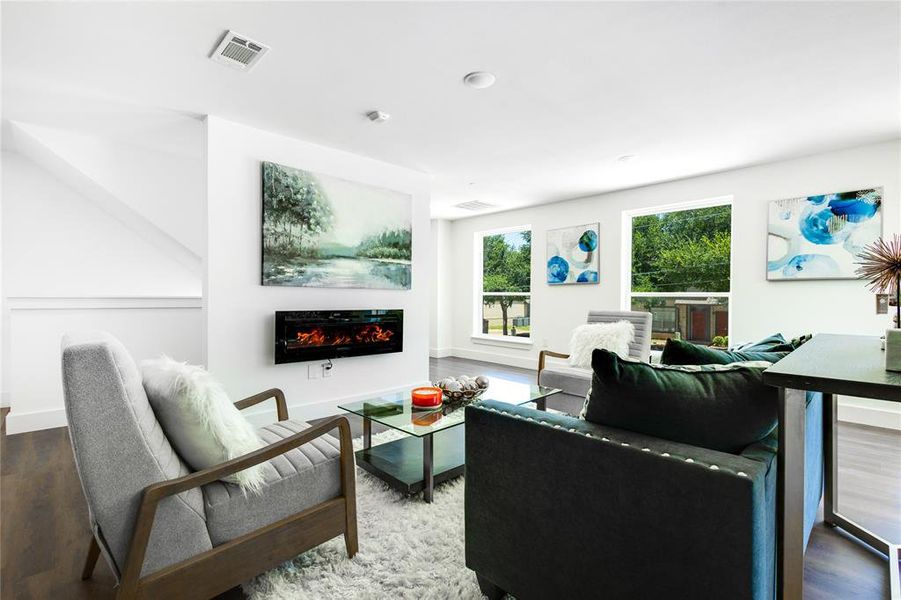 Living room with hardwood / wood-style flooring