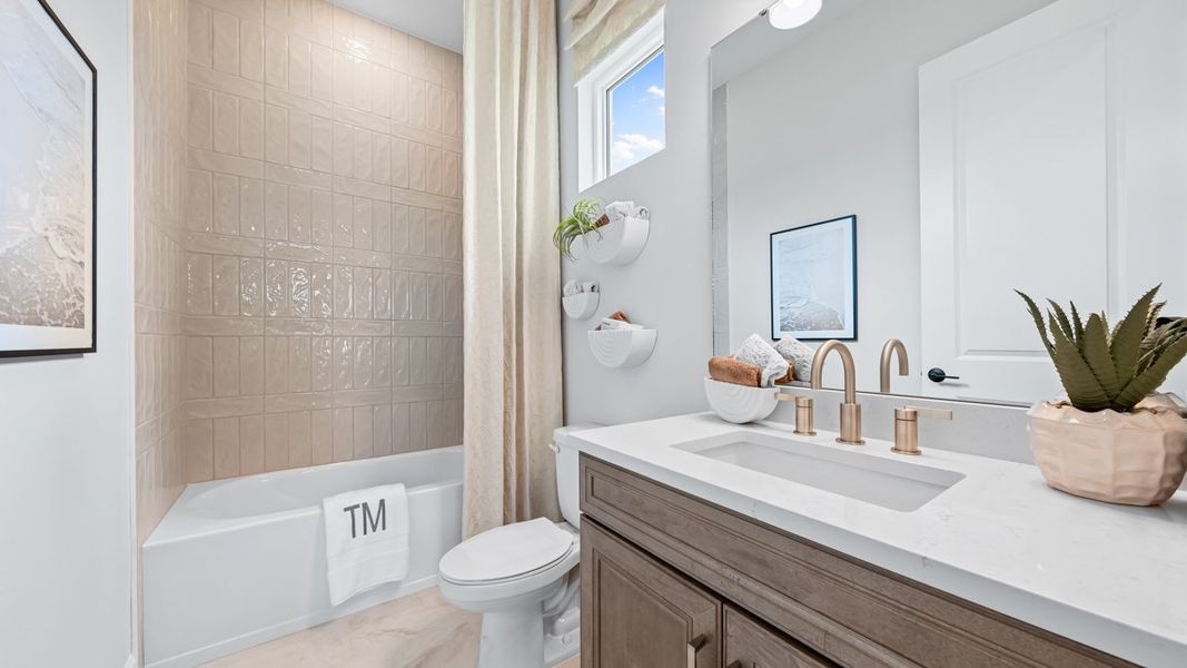 Furnished interior view inside a new home in Esplanade at Kingston, Estero (Image 16).