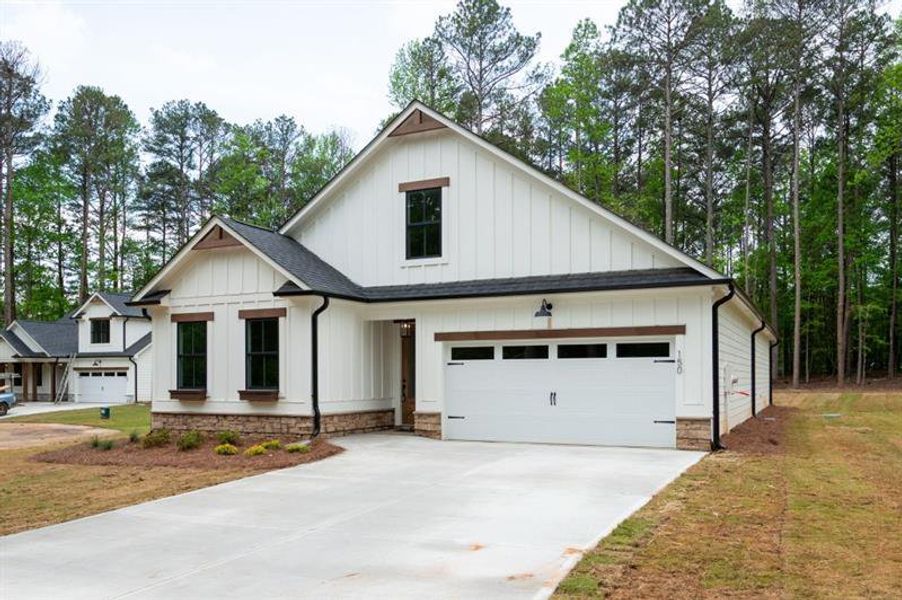 Front exterior of a new home in , Dallas, GA, highlighting curb appeal (Image 20).