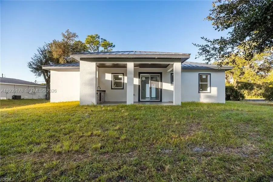 Exterior details and patio area of a home in , Labelle (Image 4).