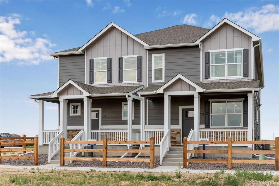 Front exterior of a new home in Vista Meadows, Fort Lupton, CO, highlighting curb appeal (Image 18).