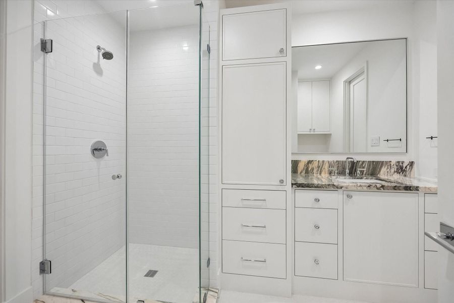 En-suite Bathroom Two with glass enclosed shower and marble top vanity En-suite Bathroom Two with glass enclosed shower and marble top vanity