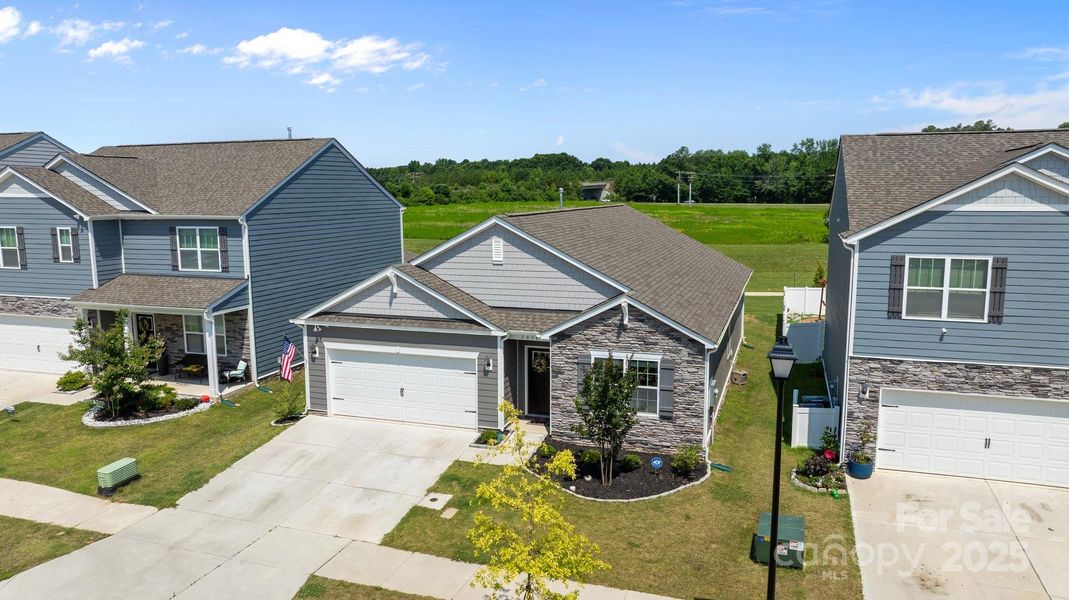 Front exterior of a new home in Secrest Commons, Monroe, NC, highlighting curb appeal (Image 23).