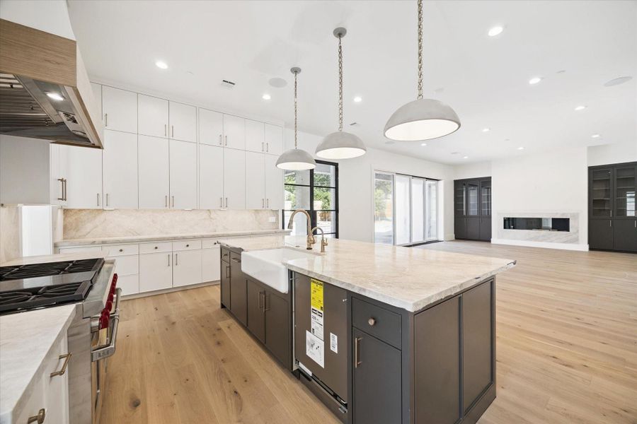 Kitchen, bar, butler's pantry, breakfast area - all open to the family room. The family room has large retractable doors to open the interior space to the exterior covered patio. Kitchen, bar, butler's pantry, breakfast area - all open to the family room. The family room has large retractable doors to open the interior space to the exterior covered patio.