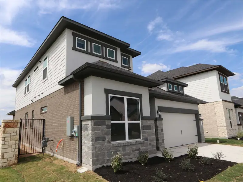 Exterior details and patio area of a home in Estancia West, Manchaca (Image 16).