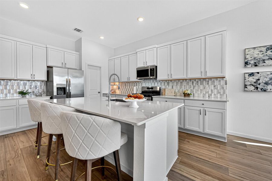 This spacious island is perfect for casual dining and family activities. This spacious island is perfect for casual dining and family activities.