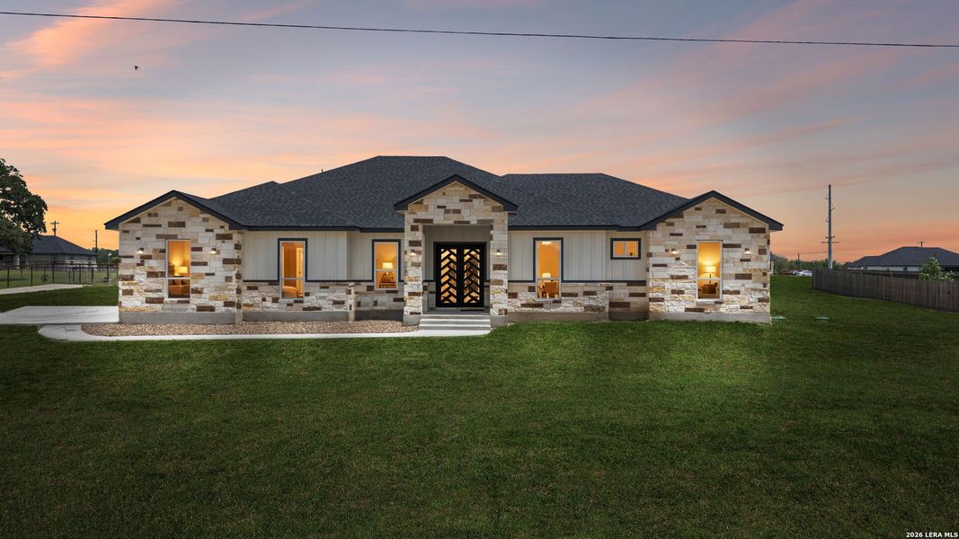Front exterior of a new home in , La Vernia, TX, highlighting curb appeal (Image 25). Front exterior of a new home in , La Vernia, TX, highlighting curb appeal (Image 25).
