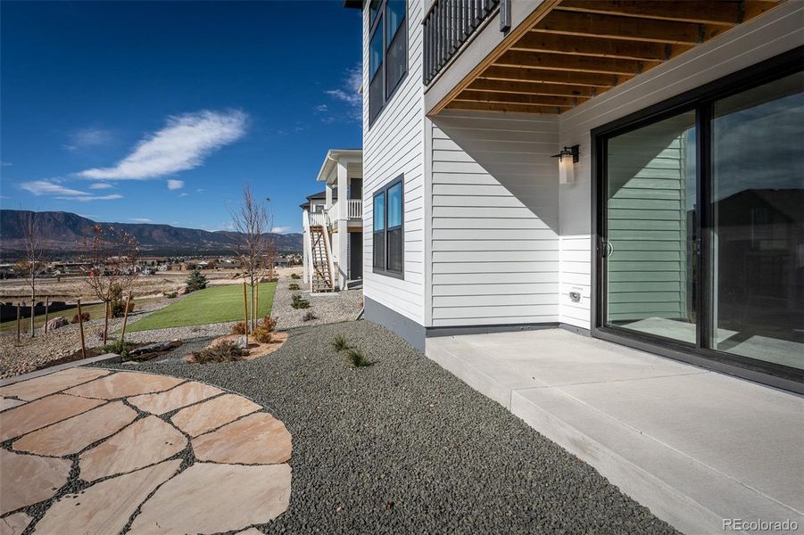 Exterior details and patio area of a home in Cloverleaf - Pinnacle Collection, Monument (Image 3).