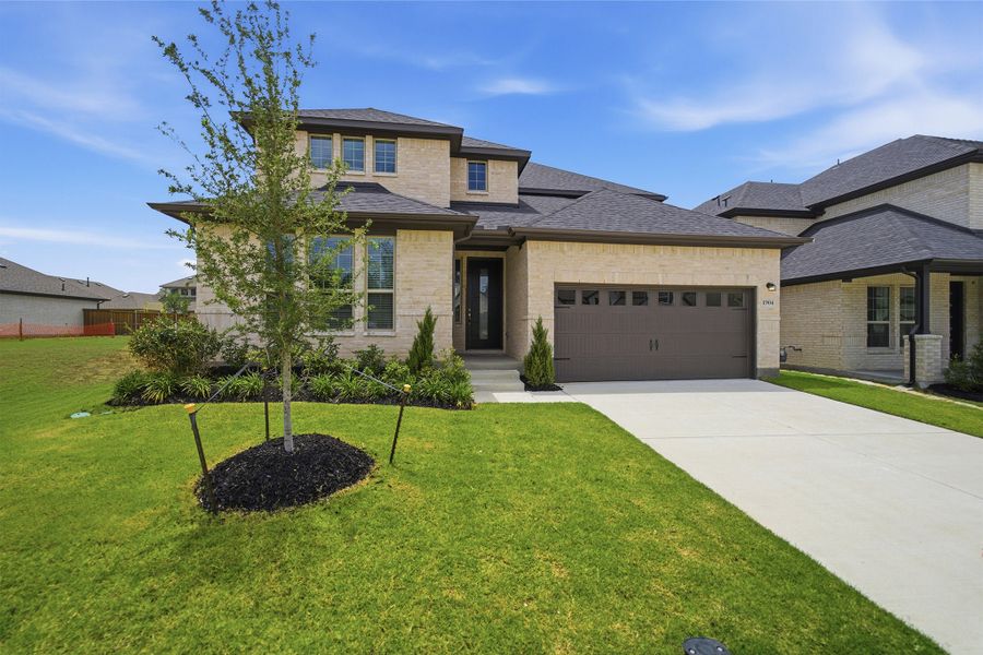 Front exterior of a new home in La Terra, Celina, TX, highlighting curb appeal (Image 2). Front exterior of a new home in La Terra, Celina, TX, highlighting curb appeal (Image 2).