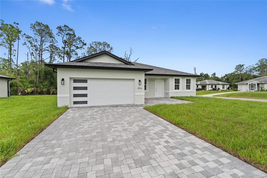 Front exterior of a new home in , North Port, FL, highlighting curb appeal (Image 17).