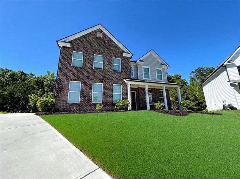 Front exterior of a new home in Autumn Brook, Austell, GA, highlighting curb appeal (Image 2). Front exterior of a new home in Autumn Brook, Austell, GA, highlighting curb appeal (Image 2).